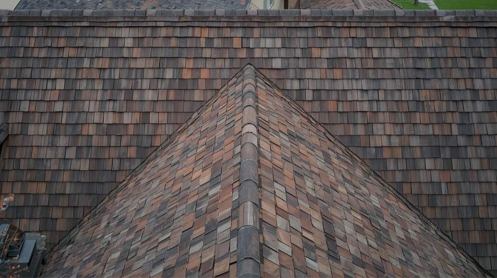 Close-up view of a wood shake roof, showcasing the textured and rough finish in the comparison of Wood Shake vs Wood Shingle.
