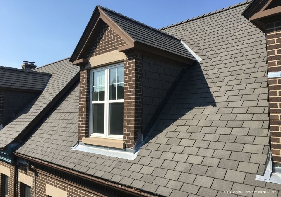Dormer vs Skylight: Classic dormer window on a traditional roof, offering a charming design and natural light.